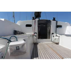 Storing a coiled halyard in a Bayabout self-closing rope bag at the mast foot